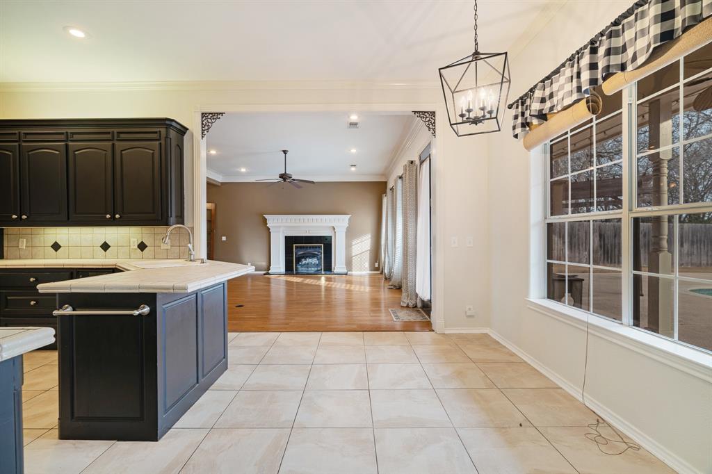 512 Brookes Way Reno, TX 75462 - Photo 13 of 27 a kitchen with stainless steel appliances granite countertop a stove a sink and a microwave