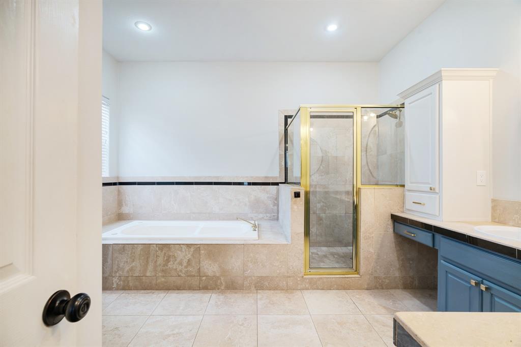 512 Brookes Way Reno, TX 75462 - Photo 16 of 27 a bathroom with a bathtub and shower