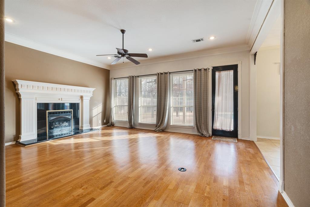 512 Brookes Way Reno, TX 75462 - Photo 19 of 27 a view of an empty room with window and wooden floor