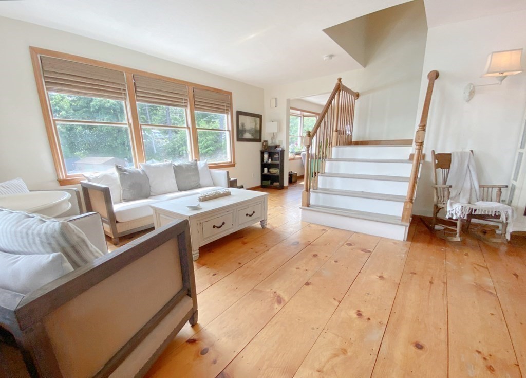 70 Uxbridge Road Mendon, MA 01756 - Photo 16 of 42 a living room with furniture and a floor to ceiling window
