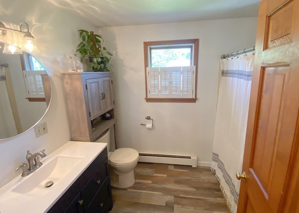 70 Uxbridge Road Mendon, MA 01756 - Photo 22 of 42 a bathroom with a sink a toilet and shower
