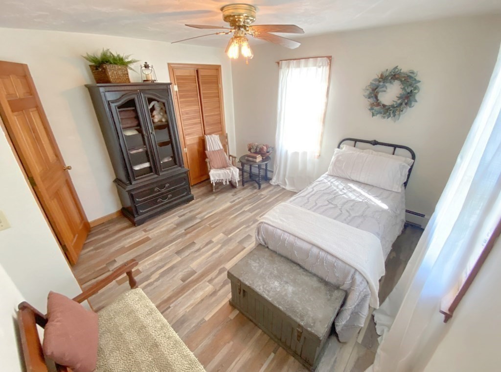 70 Uxbridge Road Mendon, MA 01756 - Photo 25 of 42 a living room with furniture and a chandelier