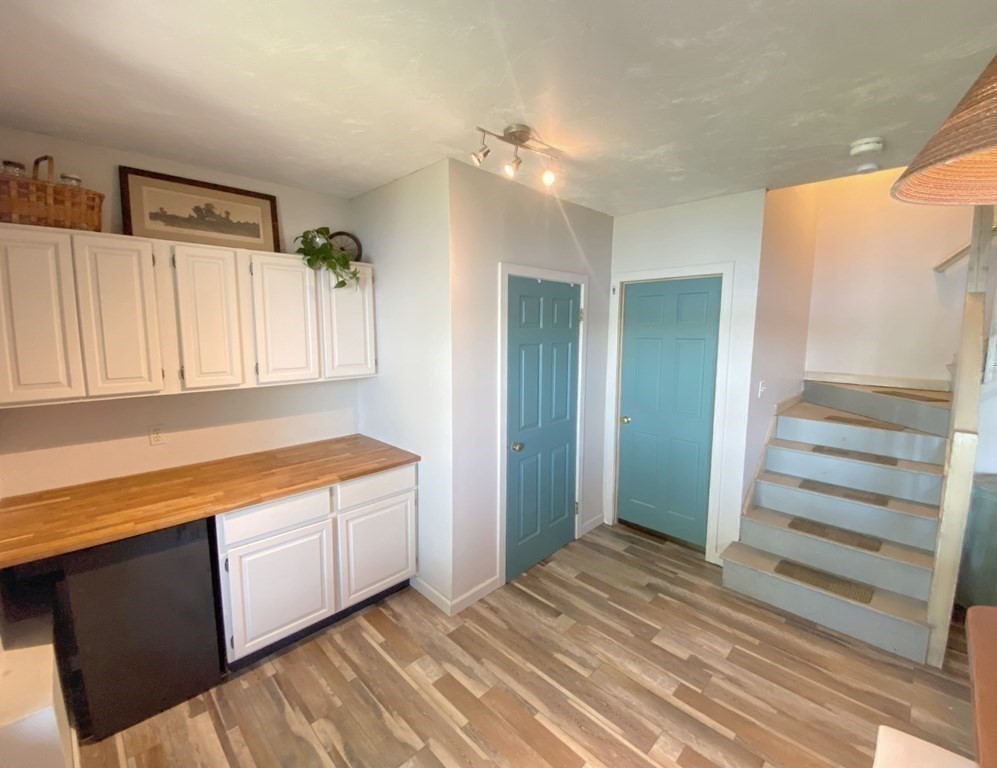 70 Uxbridge Road Mendon, MA 01756 - Photo 27 of 42 a view of a kitchen with wooden floor and a sink