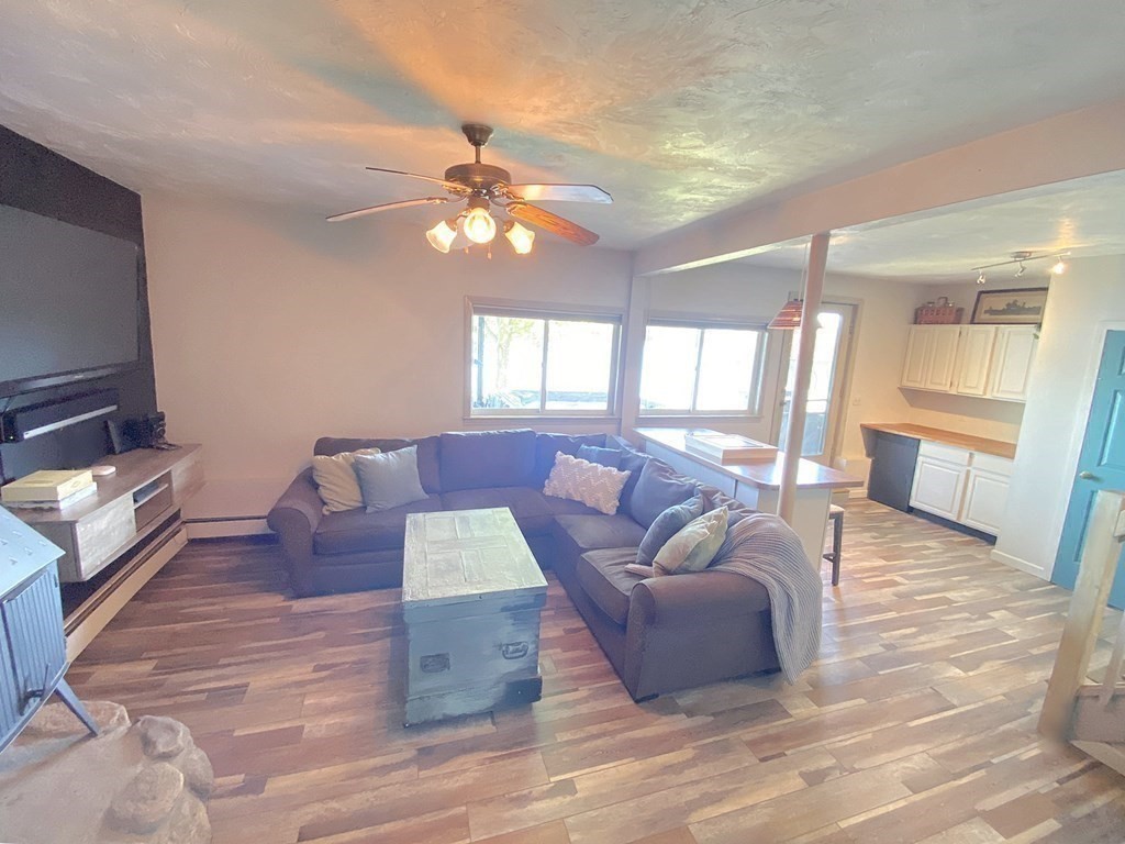70 Uxbridge Road Mendon, MA 01756 - Photo 28 of 42 a living room with furniture and a flat screen tv