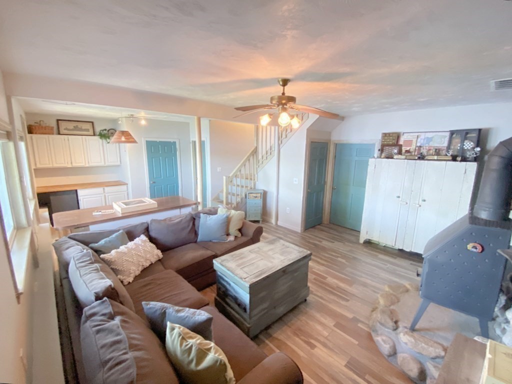 70 Uxbridge Road Mendon, MA 01756 - Photo 29 of 42 a living room with furniture and a wooden floor