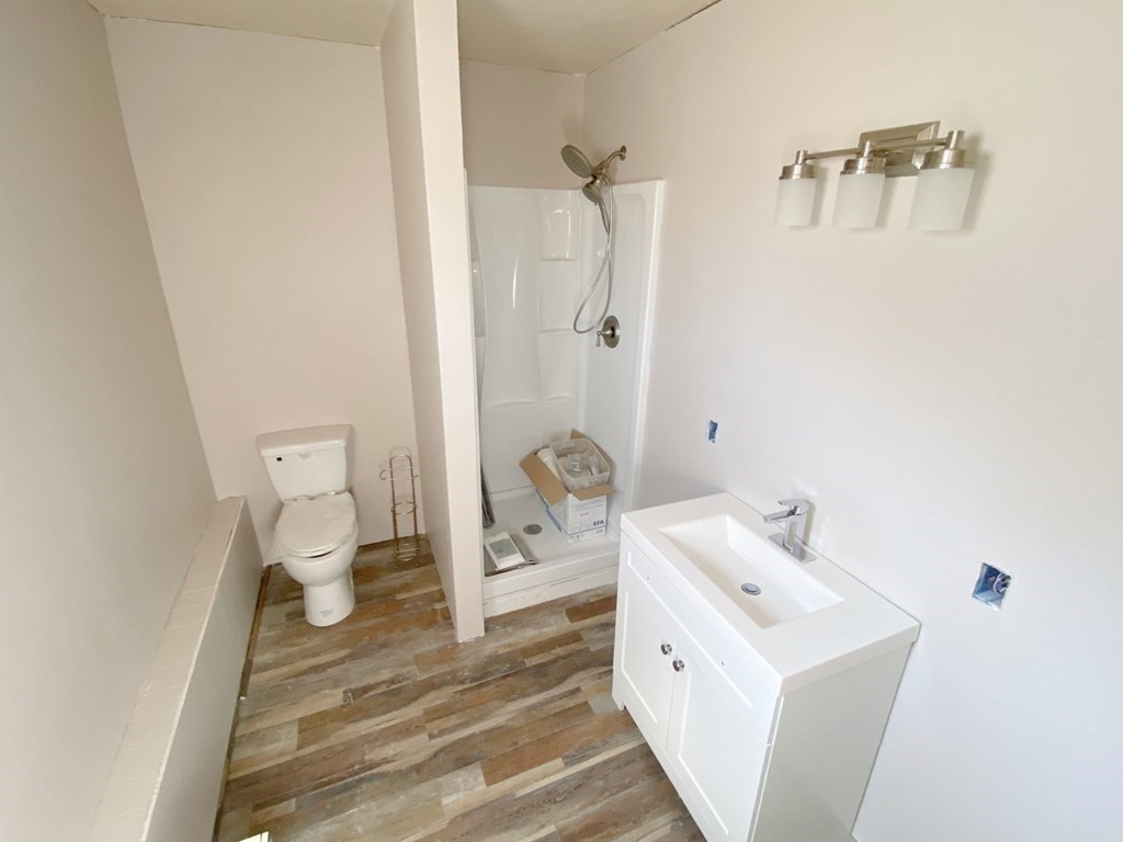 70 Uxbridge Road Mendon, MA 01756 - Photo 31 of 42 a bathroom with a sink a toilet and shower