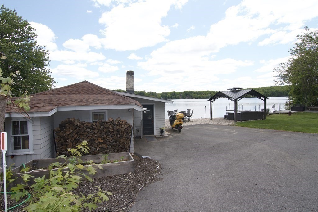 70 Uxbridge Road Mendon, MA 01756 - Photo 34 of 42 a front view of a house with garden