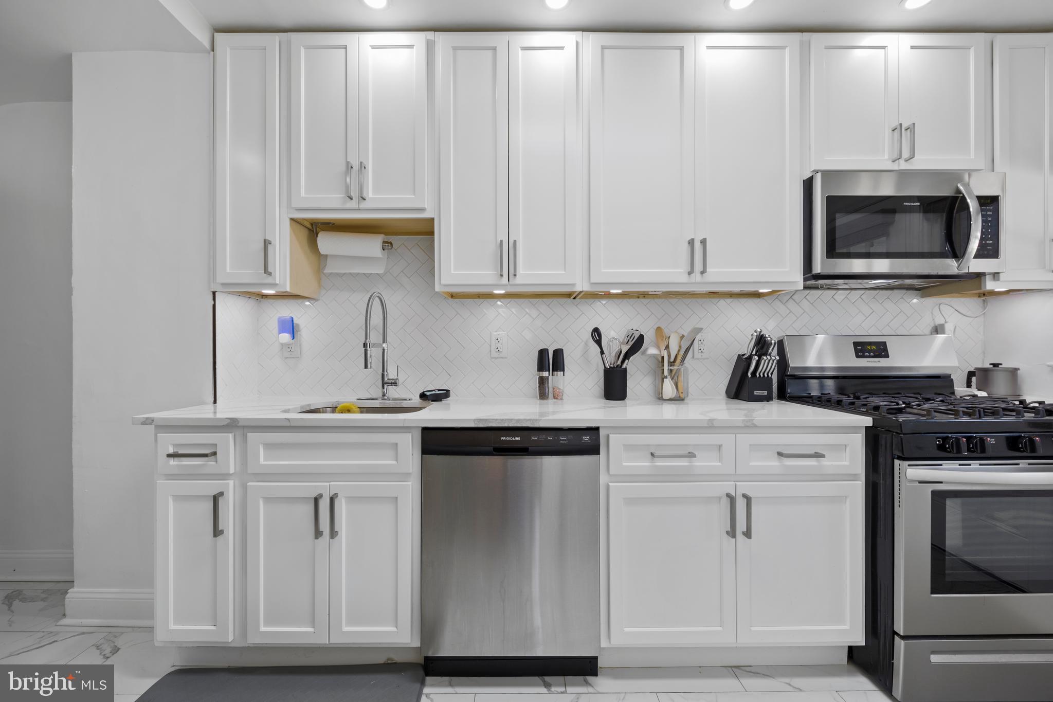 4511 Marble Hall Road Baltimore, MD 21239 - Photo 16 of 48 a kitchen with stainless steel appliances granite countertop a sink and a stove
