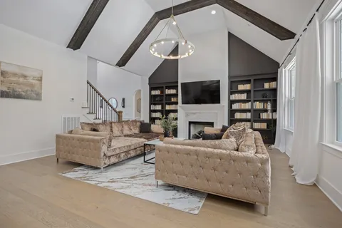 a large kitchen with a table and chairs