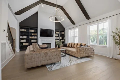 a kitchen with stainless steel appliances a stove a sink and a refrigerator