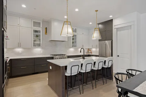 a spacious bedroom with a bed and a large window