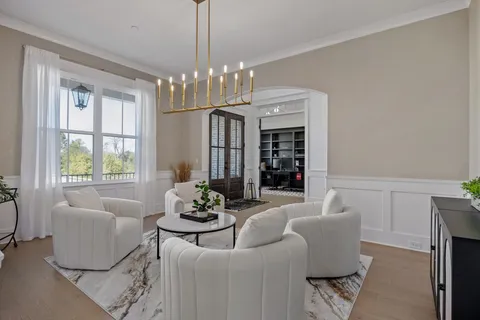 a bedroom with a bed couch and window