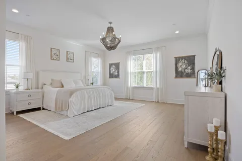 a dining room with furniture and a chandelier