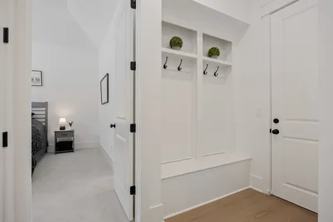 a living room with furniture a window and a flat screen tv