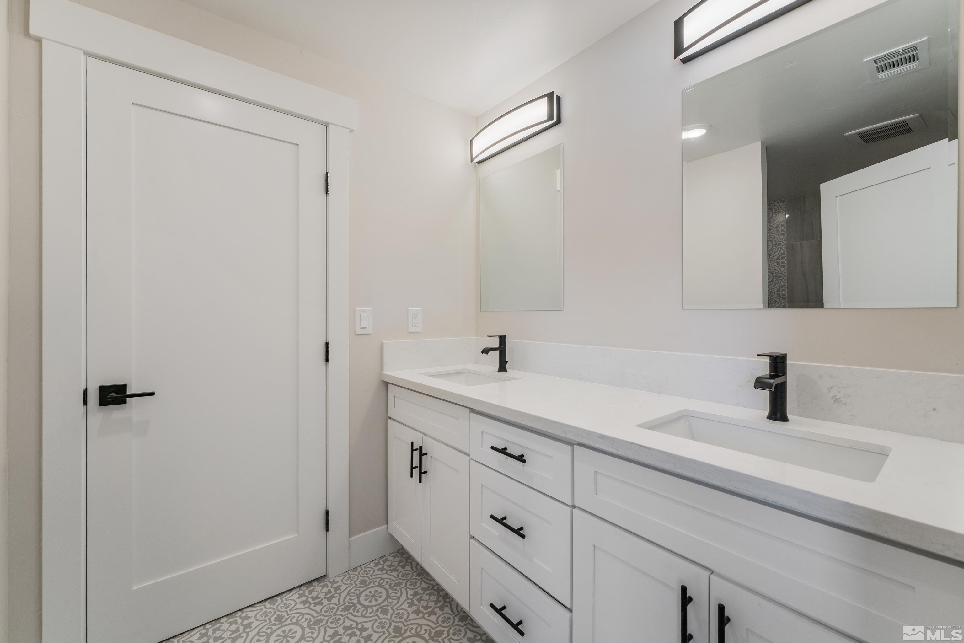 5 Sentinel Circle Carson City, NV 89701 - Photo 14 of 39 a bathroom with a sink and a mirror