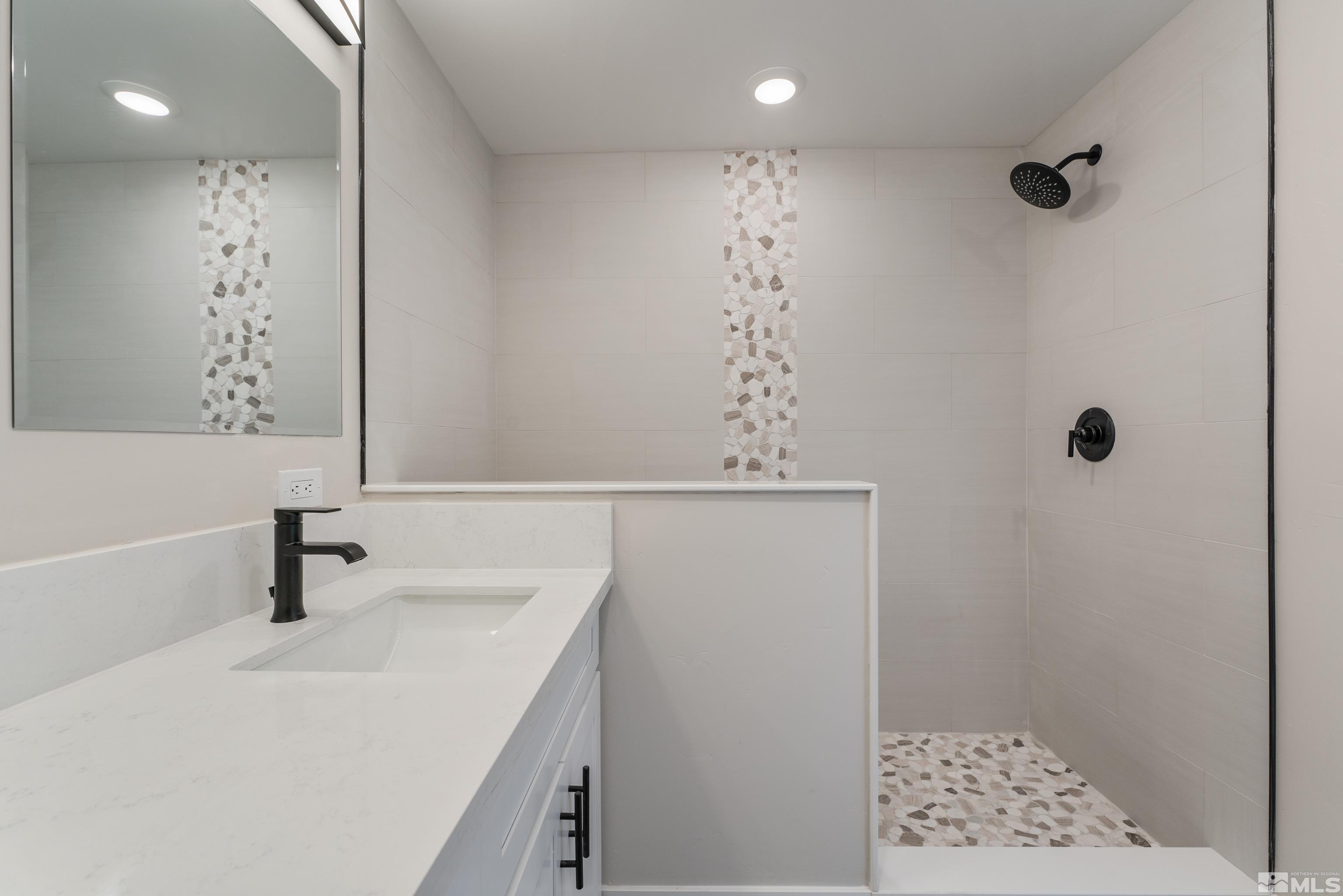 5 Sentinel Circle Carson City, NV 89701 - Photo 22 of 39 a bathroom with a sink a toilet and shower