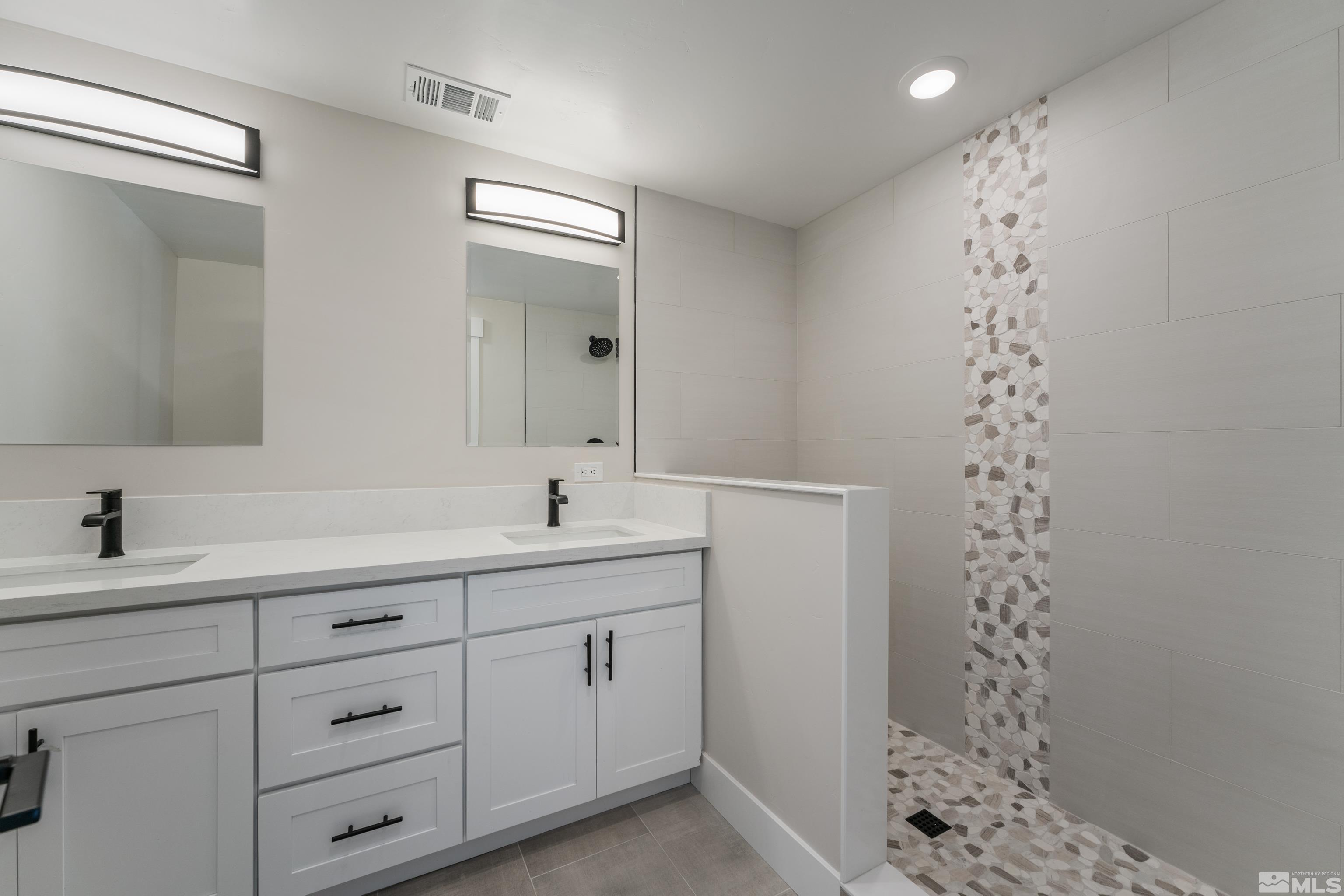 5 Sentinel Circle Carson City, NV 89701 - Photo 23 of 39 a bathroom with a sink a toilet a shower and a mirror