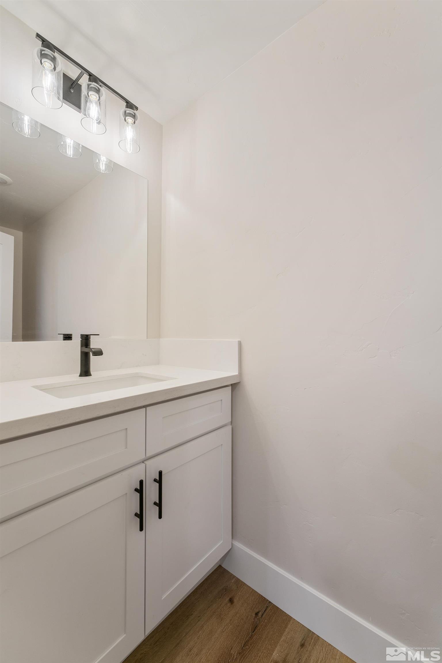 5 Sentinel Circle Carson City, NV 89701 - Photo 27 of 39 a bathroom with a sink and mirror