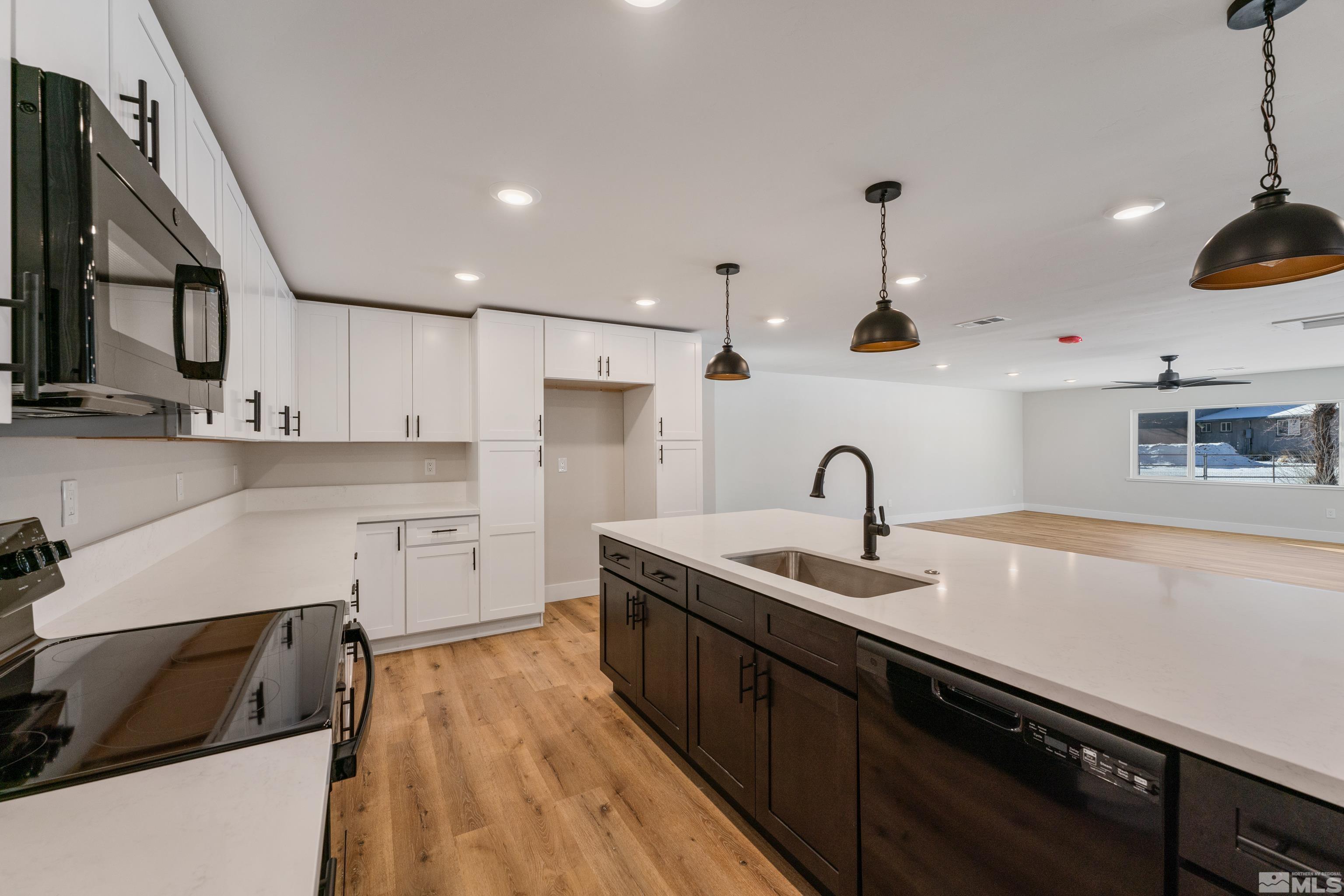 5 Sentinel Circle Carson City, NV 89701 - Photo 3 of 39 a kitchen with kitchen island granite countertop a sink stainless steel appliances and cabinets