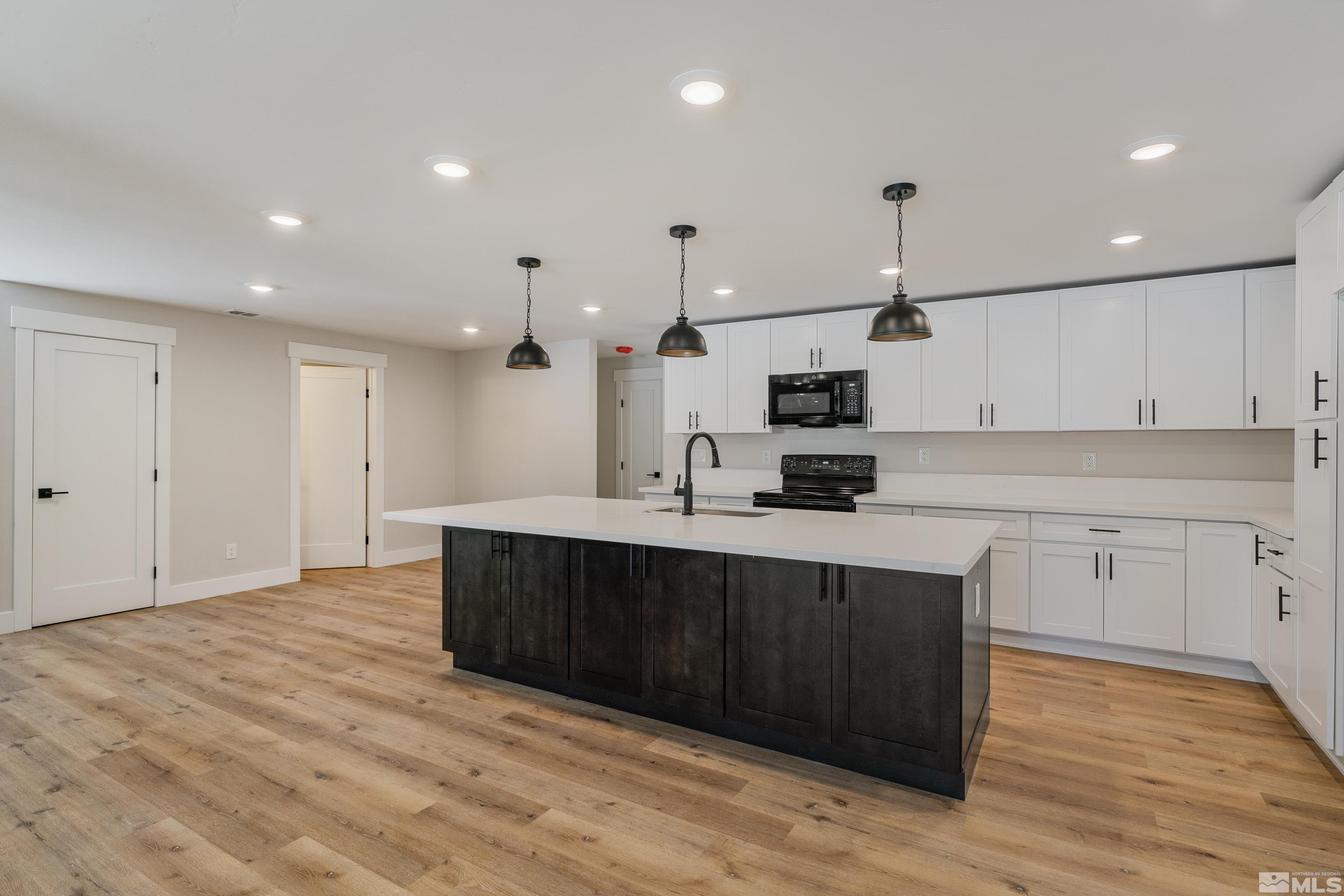 5 Sentinel Circle Carson City, NV 89701 - Photo 9 of 39 a kitchen with stainless steel appliances granite countertop a sink a stove and a refrigerator