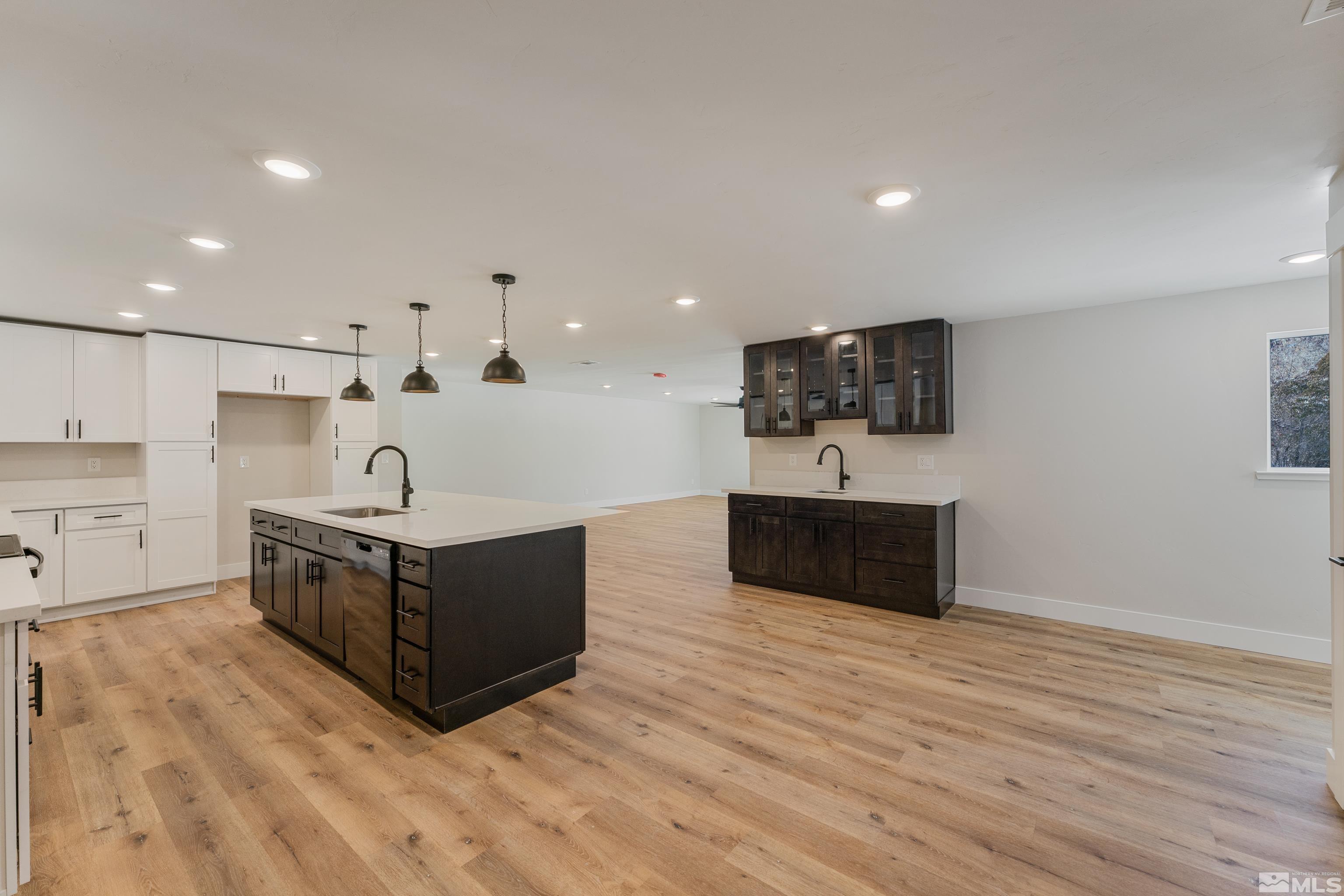 5 Sentinel Circle Carson City, NV 89701 - Photo 10 of 39 a large kitchen with stainless steel appliances a large counter top and a wooden floors