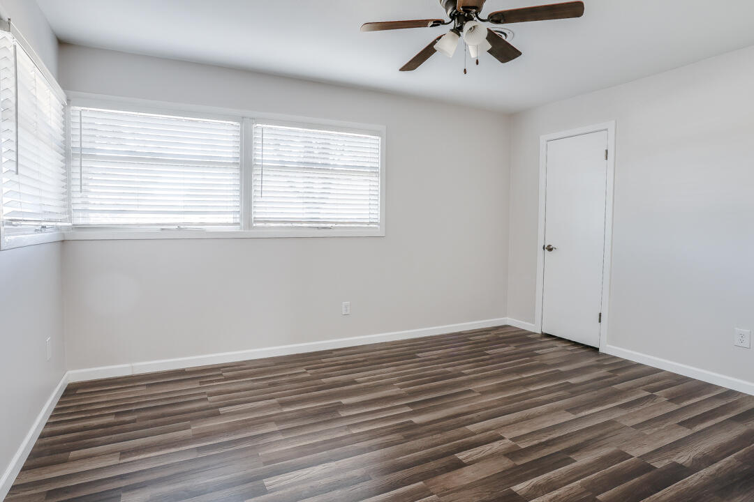 2123 66th Street Lubbock, TX 79412 - Photo 13 of 16 wooden floor in an empty room with a window