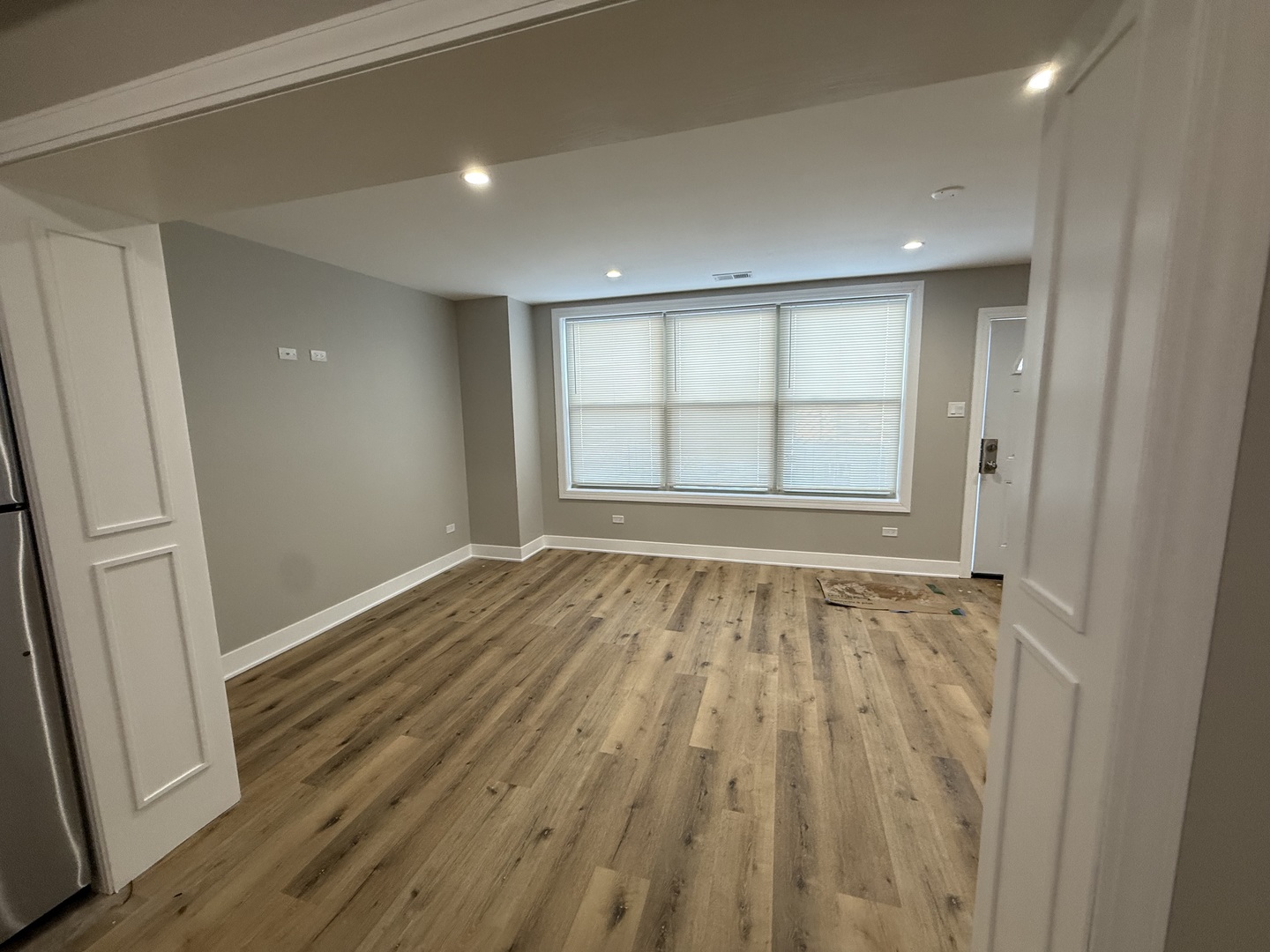 6634 Cermak Road, Unit 2 Berwyn, IL 60402 - Photo 13 of 20 an empty room with wooden floor and windows