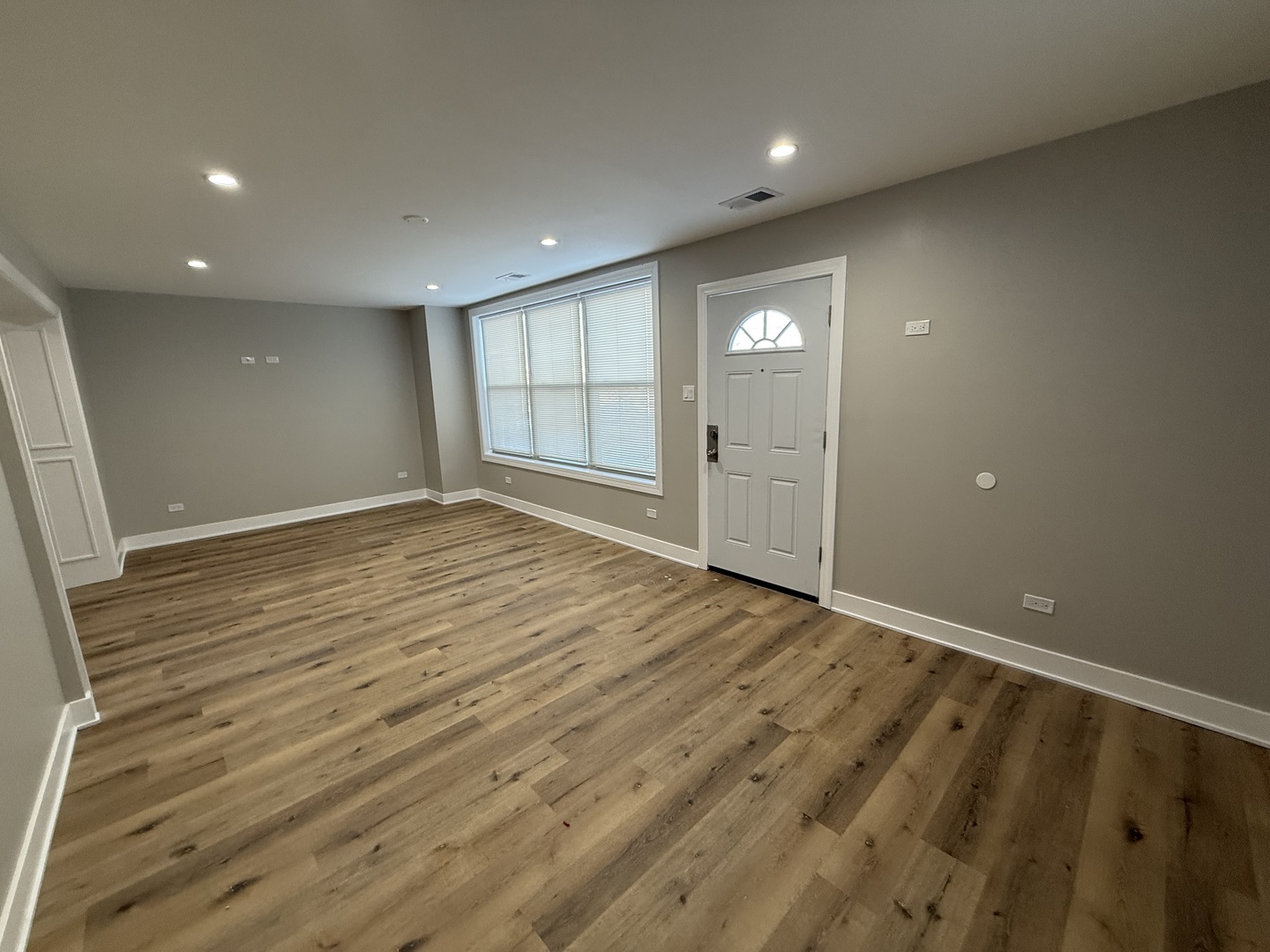 6634 Cermak Road, Unit 2 Berwyn, IL 60402 - Photo 14 of 20 an empty room with wooden floor and windows