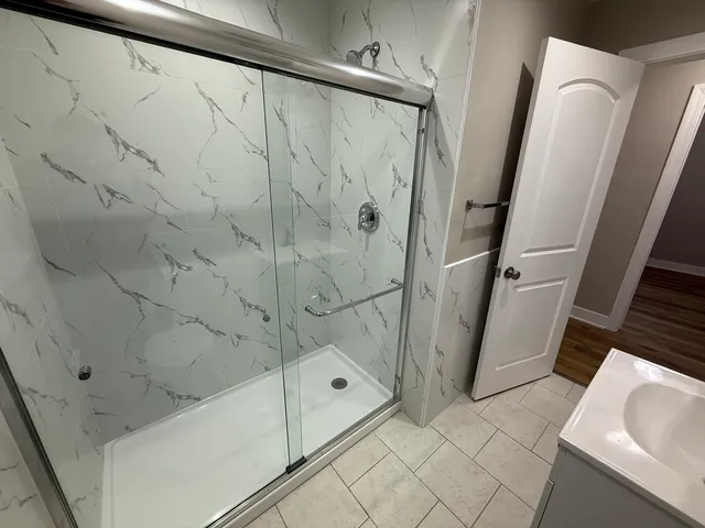 a white toilet sitting next to a bathroom sink