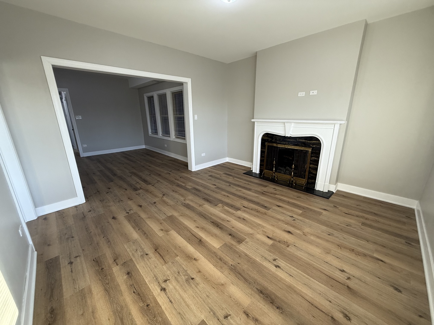 6634 Cermak Road, Unit 2 Berwyn, IL 60402 - Photo 4 of 20 a view of empty room with wooden floor and fireplace