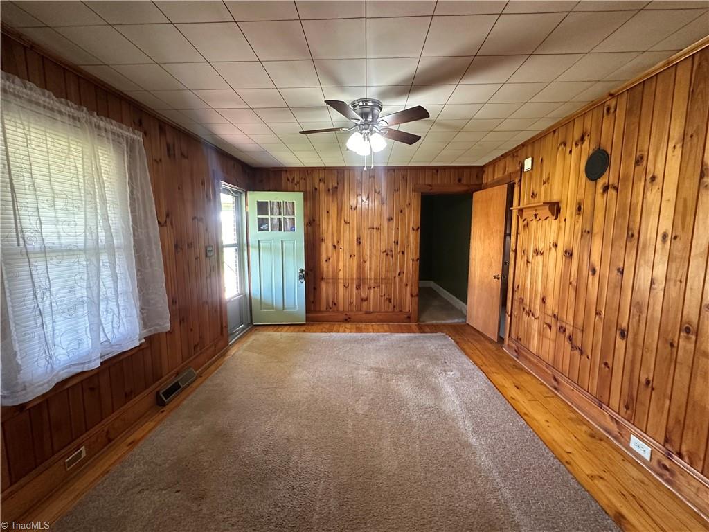 285 Oak Ridge Church Road Hays, NC 28635 - Photo 9 of 32 Living Room with Pine Walls & FLooring