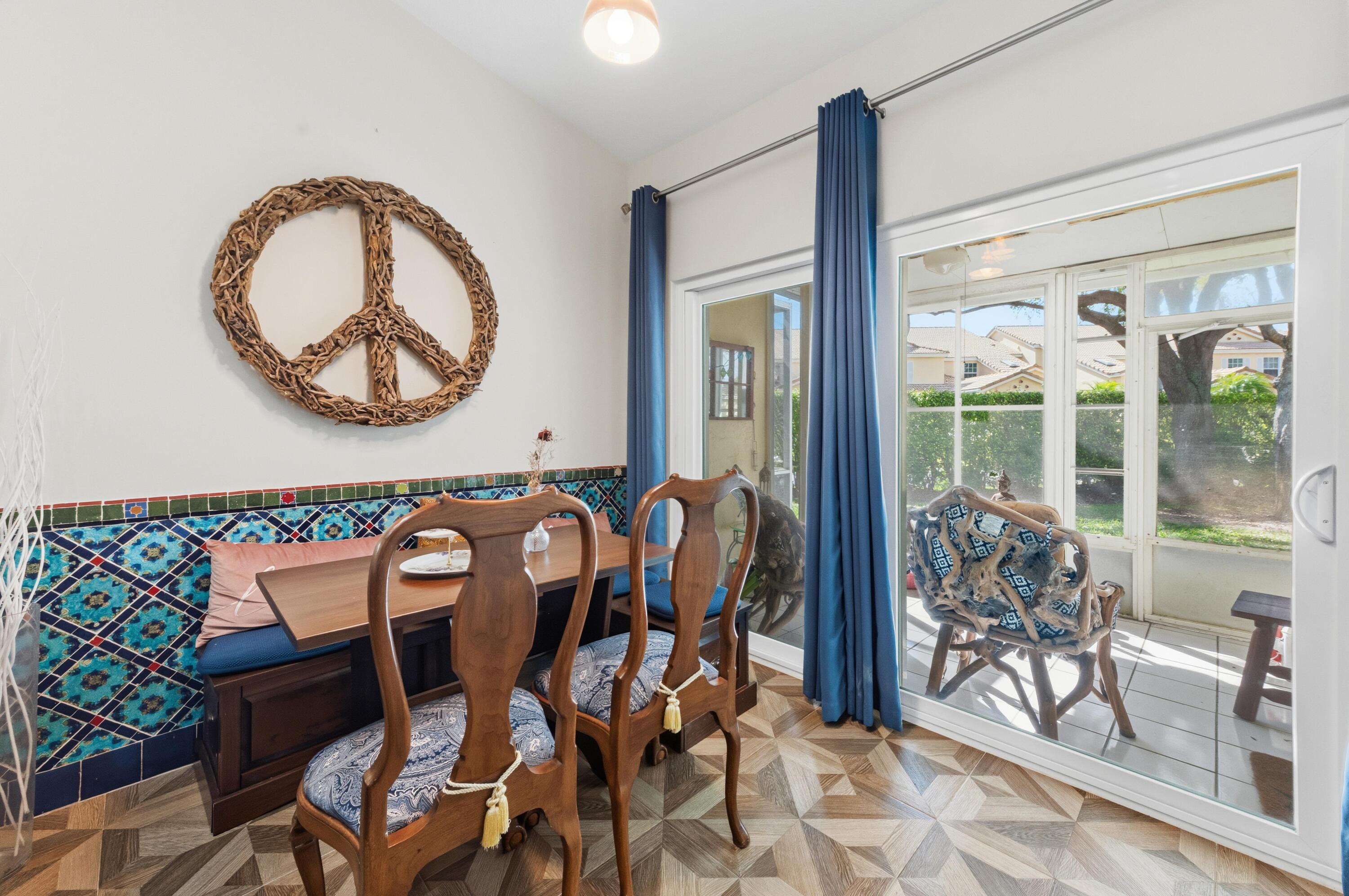 17221 Boca Club Boulevard, Unit 3 Boca Raton, FL 33487 - Photo 14 of 47 a view of a dining room with furniture and chandelier