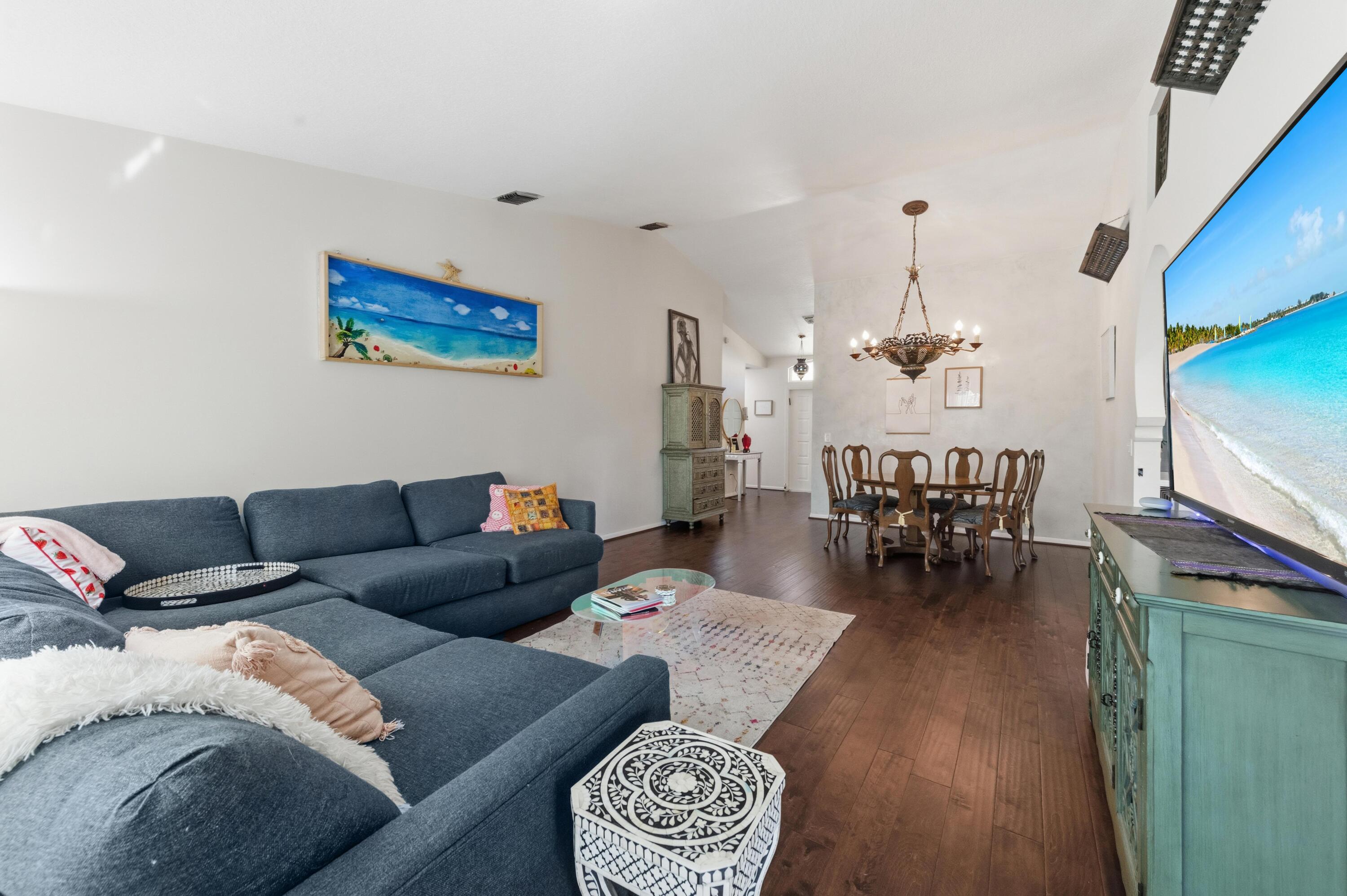 17221 Boca Club Boulevard, Unit 3 Boca Raton, FL 33487 - Photo 16 of 47 a living room with furniture and a flat screen tv