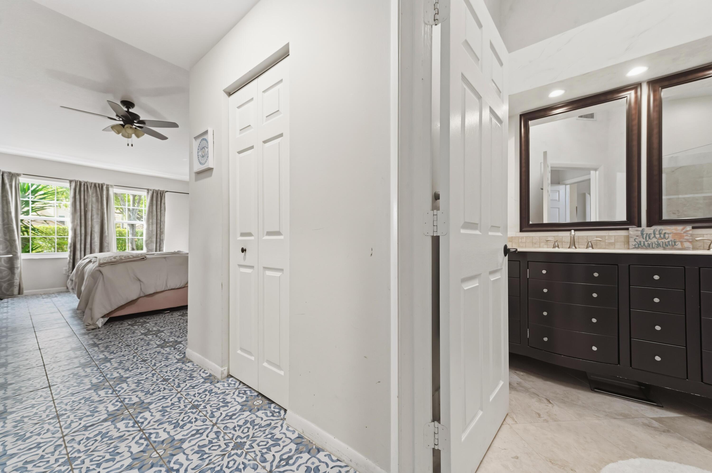 17221 Boca Club Boulevard, Unit 3 Boca Raton, FL 33487 - Photo 17 of 47 a spacious bathroom with a granite countertop sink and a mirror
