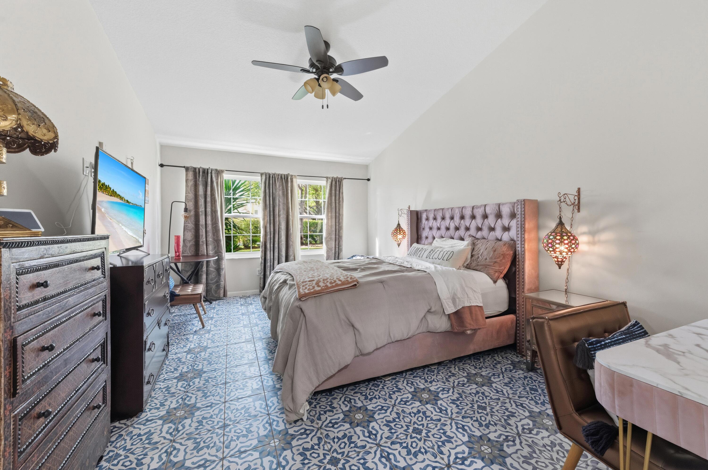 17221 Boca Club Boulevard, Unit 3 Boca Raton, FL 33487 - Photo 18 of 47 a bedroom with a bed a desk and chair with the wooden floor