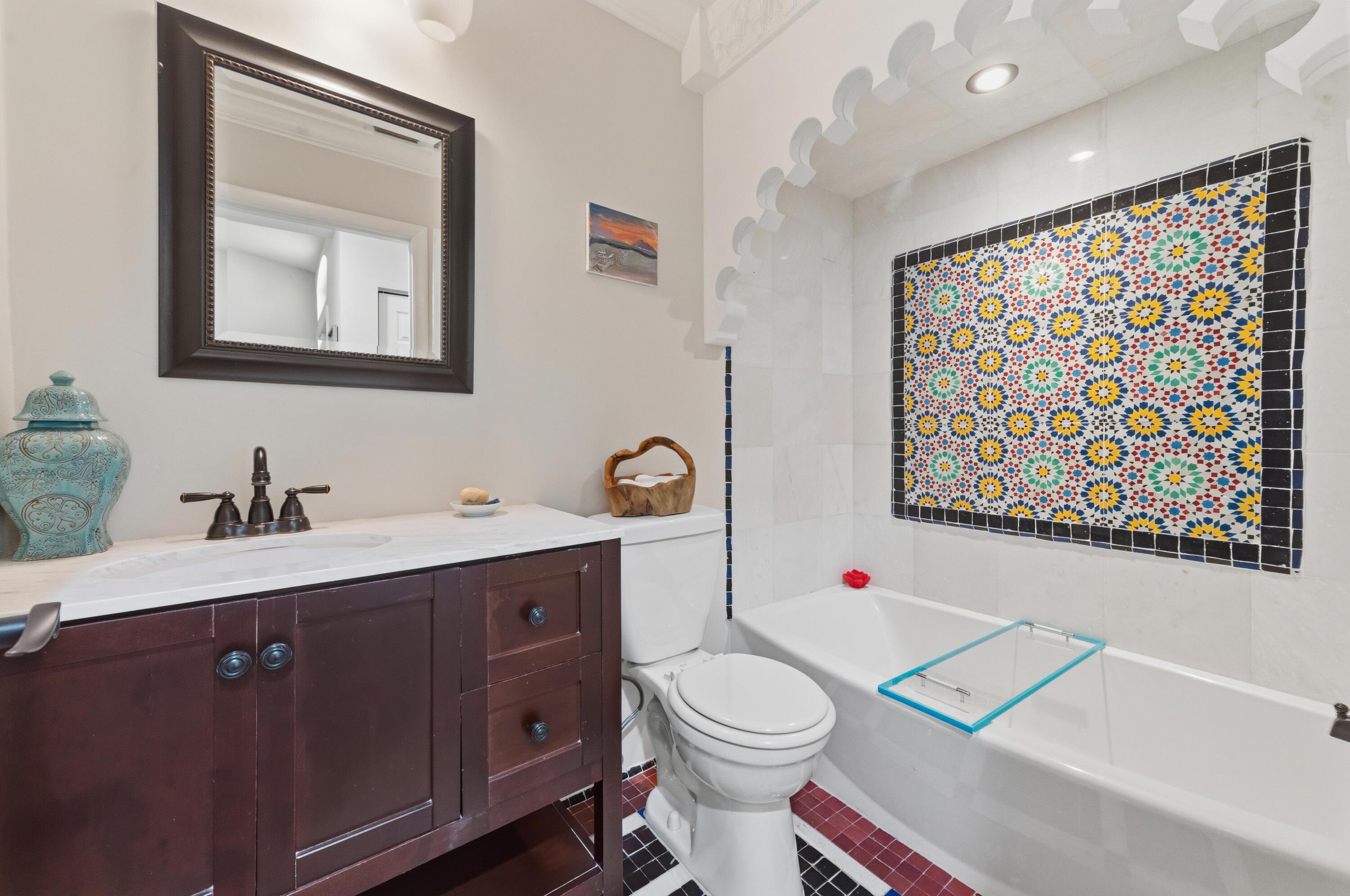 17221 Boca Club Boulevard, Unit 3 Boca Raton, FL 33487 - Photo 24 of 47 a bathroom with a toilet a sink and mirror