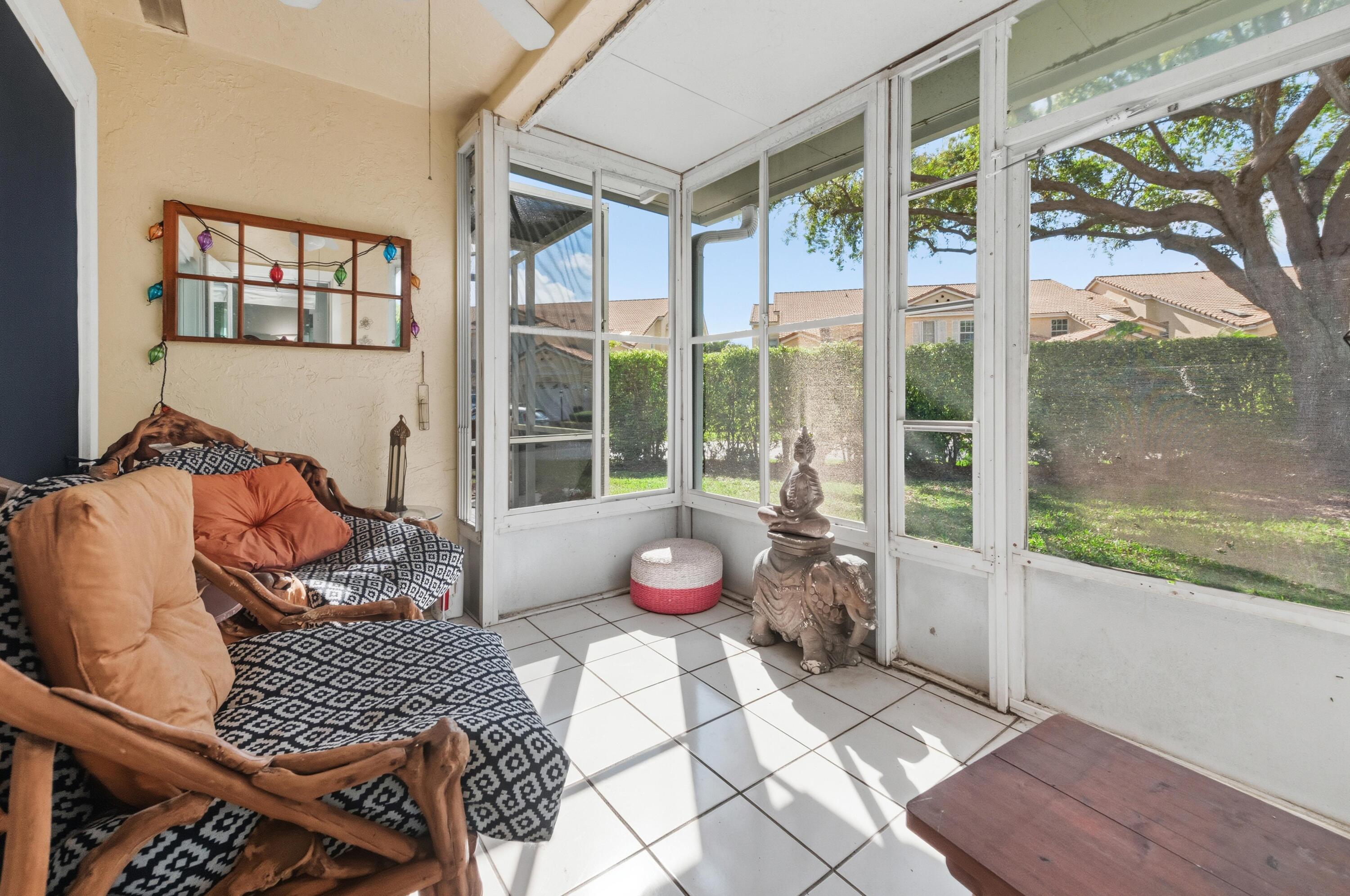 17221 Boca Club Boulevard, Unit 3 Boca Raton, FL 33487 - Photo 27 of 47 a living room with furniture and a floor to ceiling window