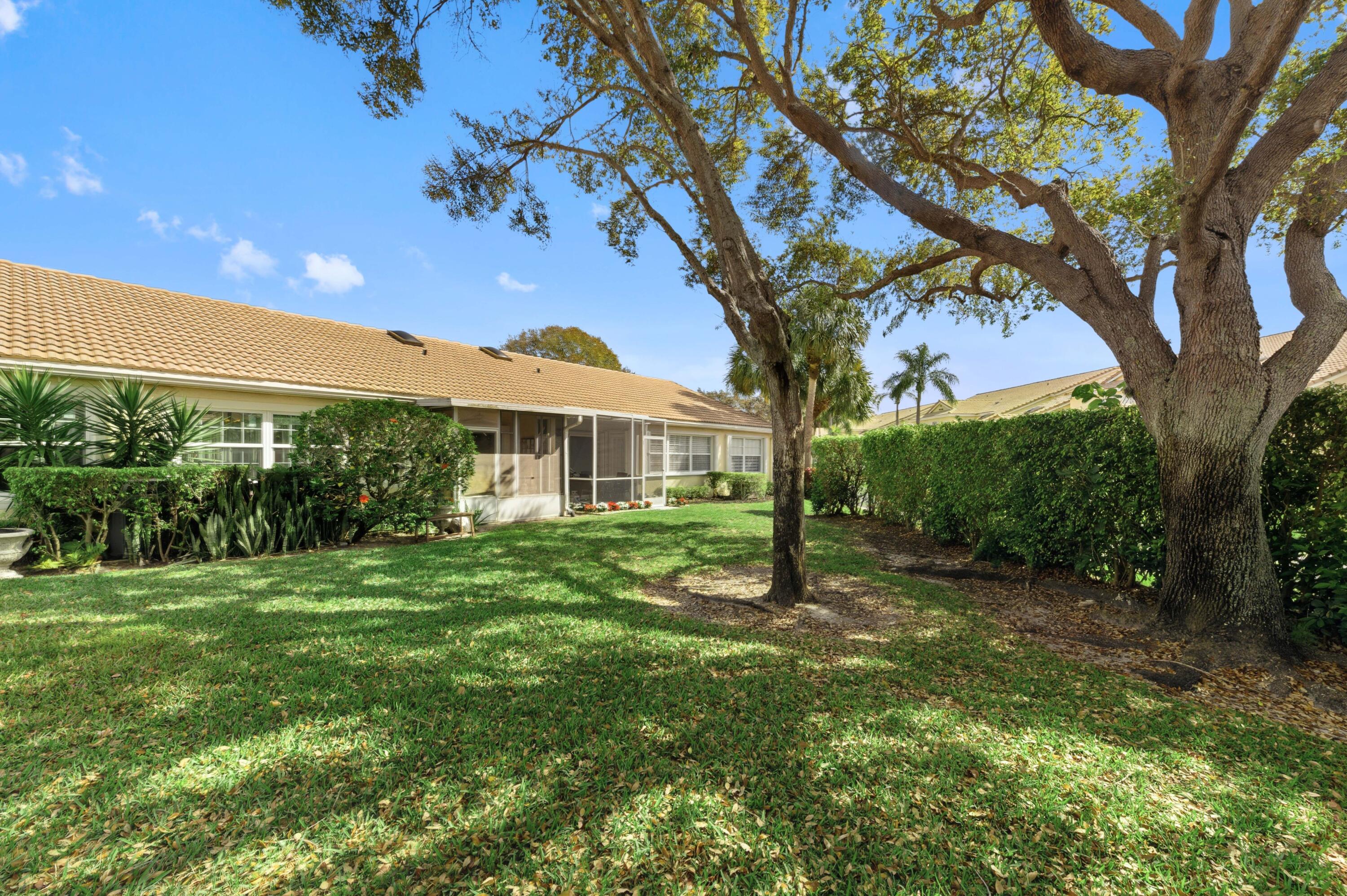 17221 Boca Club Boulevard, Unit 3 Boca Raton, FL 33487 - Photo 28 of 47 a view of a house with a backyard