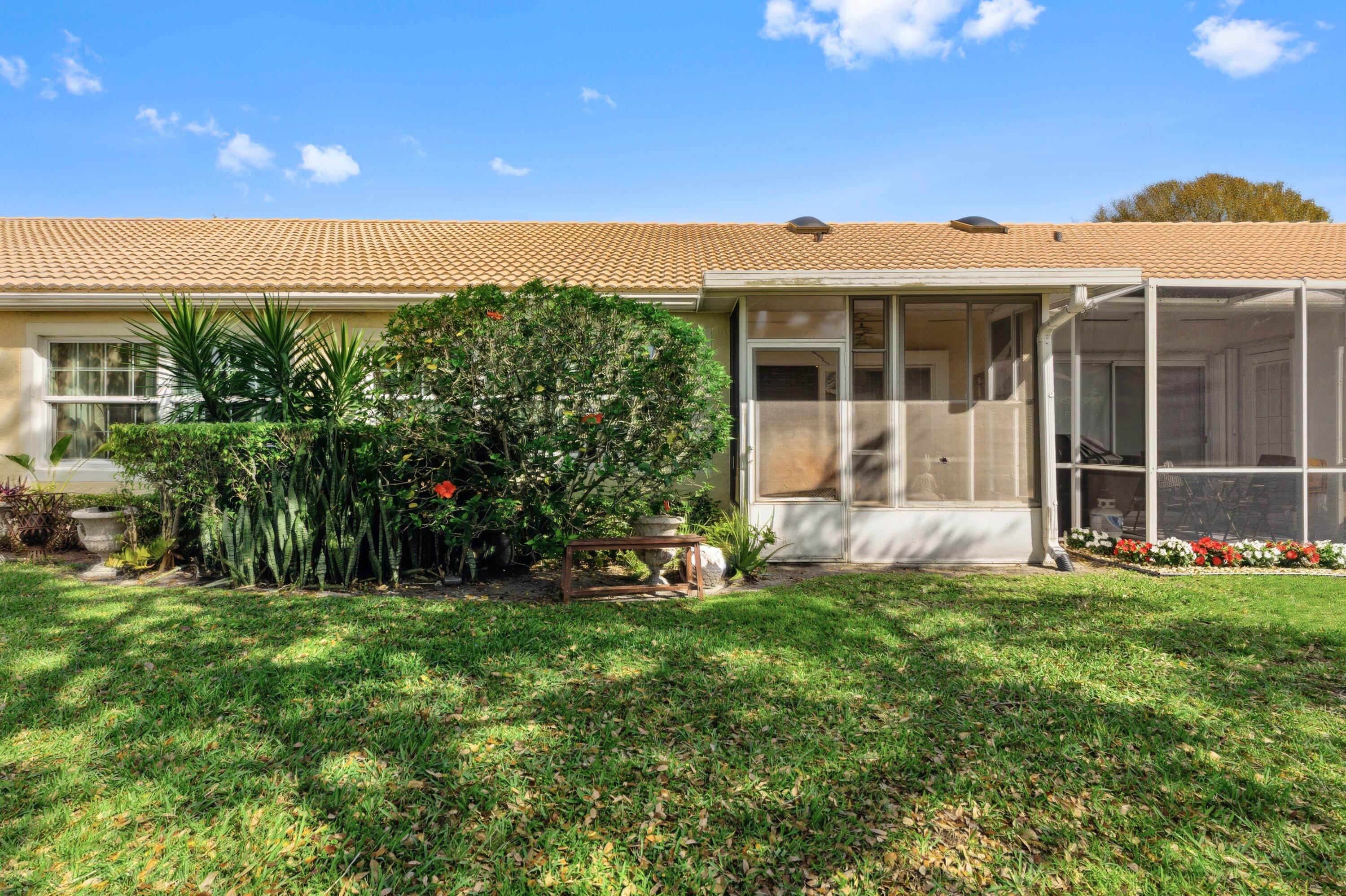 17221 Boca Club Boulevard, Unit 3 Boca Raton, FL 33487 - Photo 29 of 47 a view of a house with a yard and sitting area