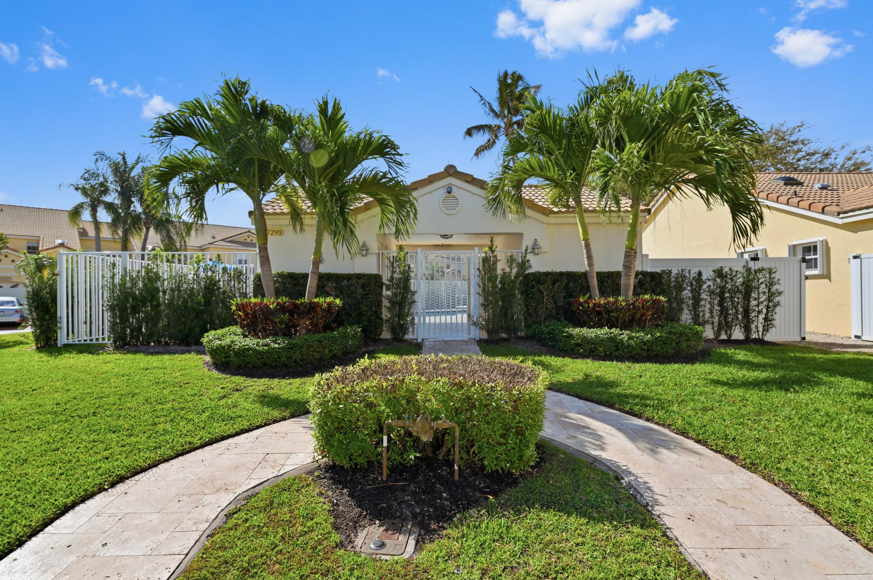 17221 Boca Club Boulevard, Unit 3 Boca Raton, FL 33487 - Photo 30 of 47 a front view of a house with garden