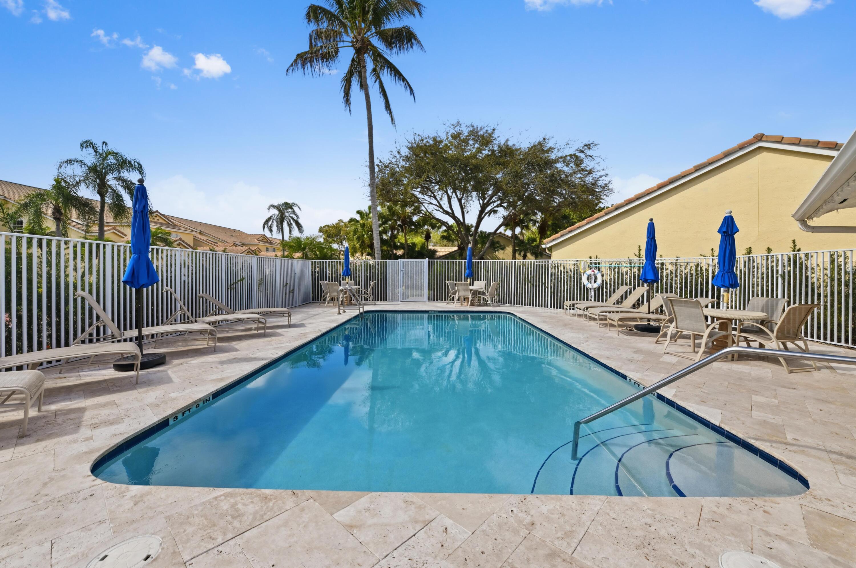 17221 Boca Club Boulevard, Unit 3 Boca Raton, FL 33487 - Photo 31 of 47 a view of a swimming pool with a patio