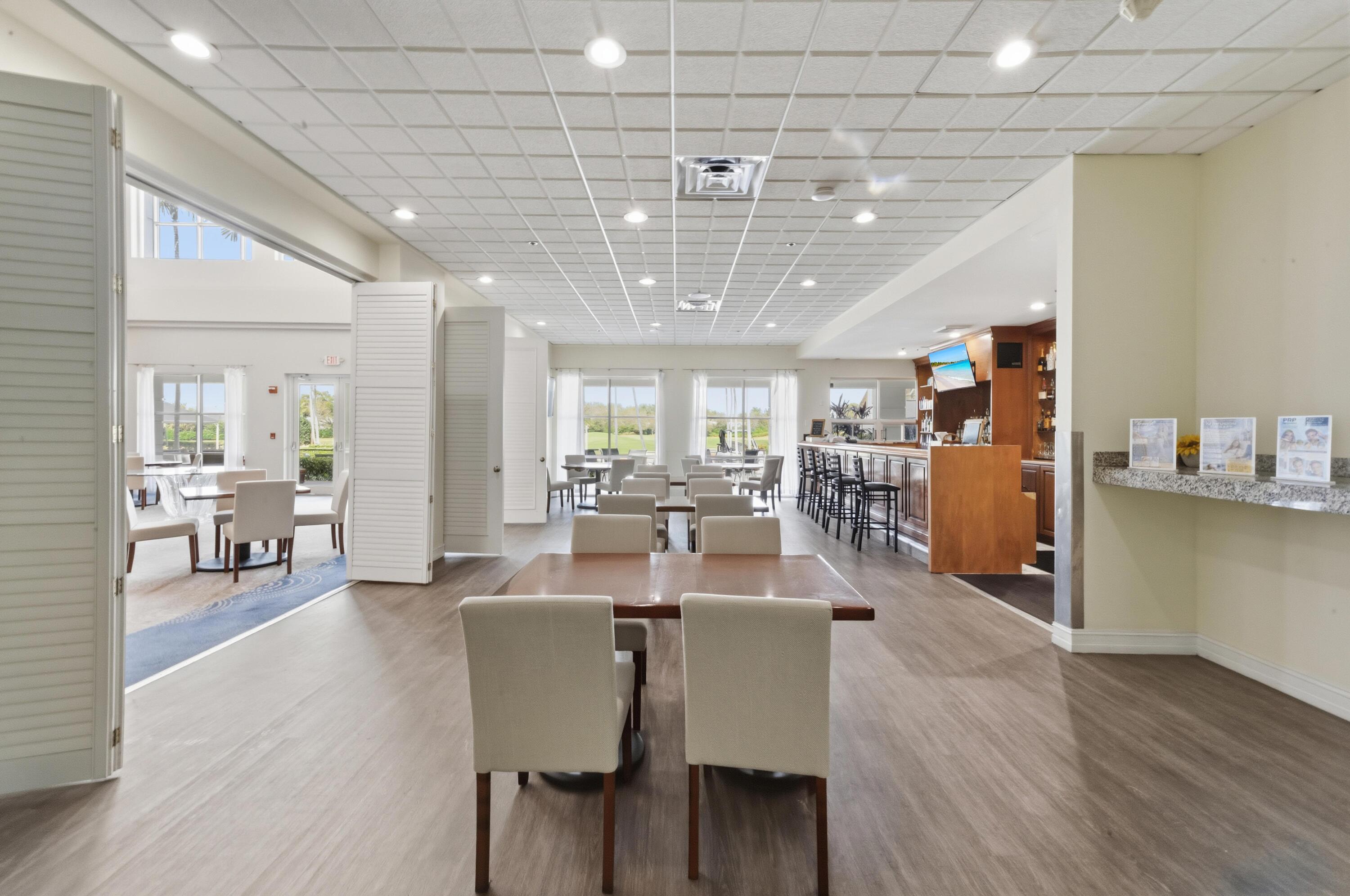 17221 Boca Club Boulevard, Unit 3 Boca Raton, FL 33487 - Photo 34 of 47 a view of a dining area with furniture window and wooden floor