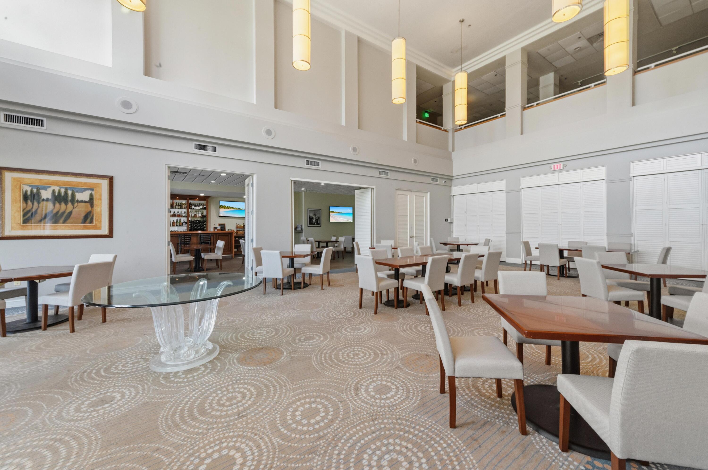 17221 Boca Club Boulevard, Unit 3 Boca Raton, FL 33487 - Photo 35 of 47 a room with lots of table chair