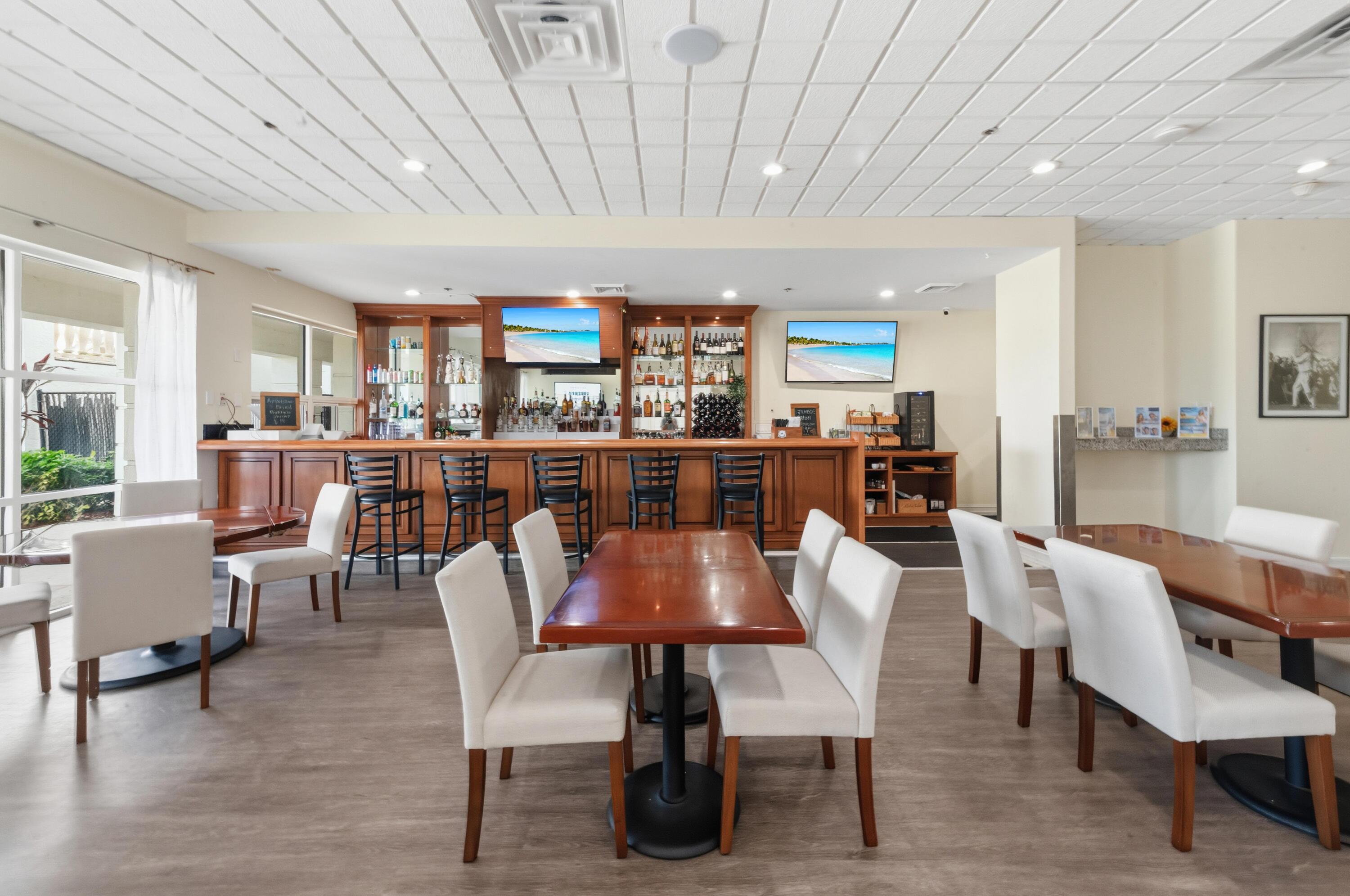 17221 Boca Club Boulevard, Unit 3 Boca Raton, FL 33487 - Photo 36 of 47 a view of a dining room with furniture window and wooden floor