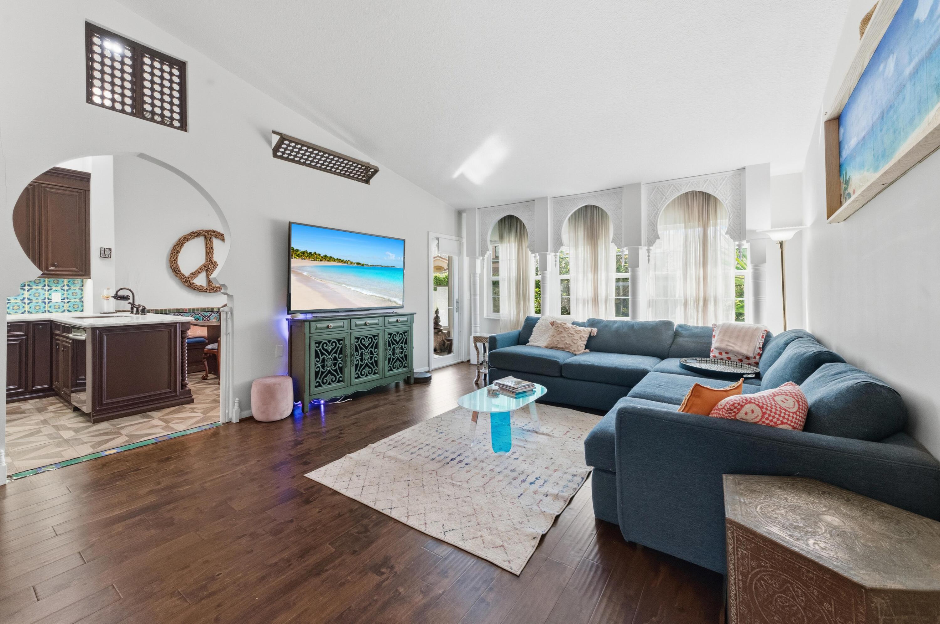 17221 Boca Club Boulevard, Unit 3 Boca Raton, FL 33487 - Photo 7 of 47 a living room with furniture and a flat screen tv