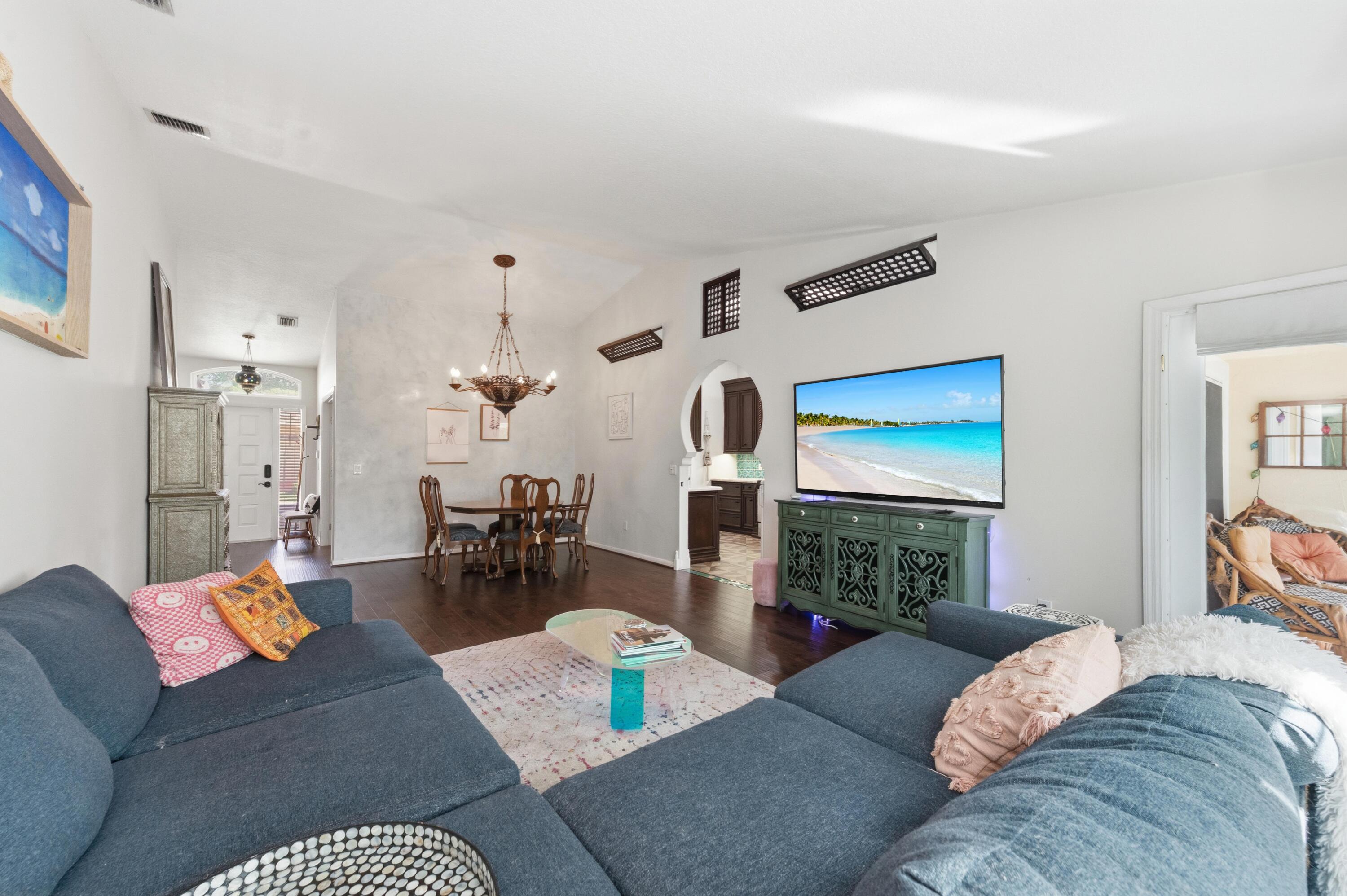 17221 Boca Club Boulevard, Unit 3 Boca Raton, FL 33487 - Photo 8 of 47 a living room with furniture and a fireplace