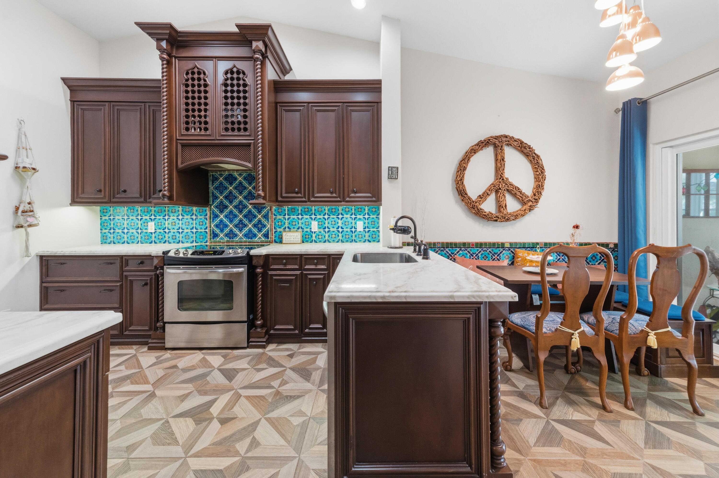 17221 Boca Club Boulevard, Unit 3 Boca Raton, FL 33487 - Photo 10 of 47 a kitchen with a stove and a table