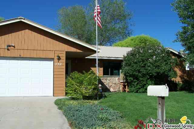 752 Cactus Court Rifle, CO 81650 - Photo 2 of 7 a front view of a house with garden