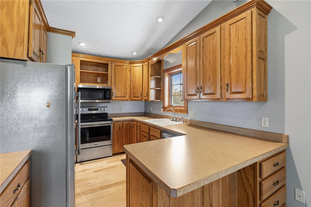 4971 Lackey Road Cedarville, OH 45314 - Photo 51 of 79 This bright kitchen features ample cabinetry, modern appliances, and a convenient layout.