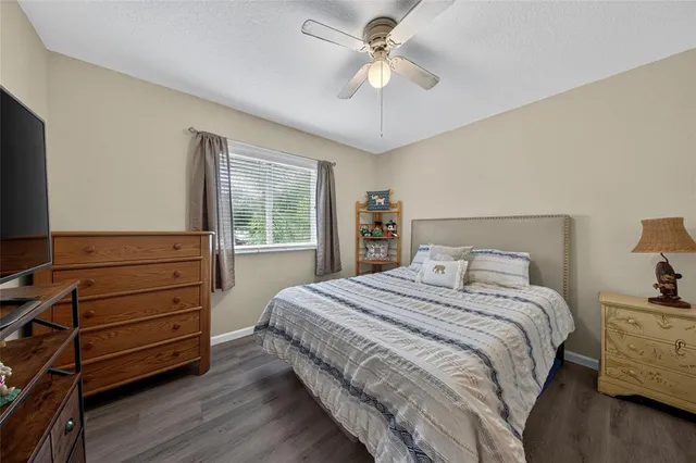 a bedroom with a bed and a dresser